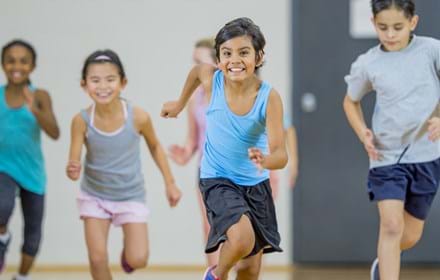 Children Running In Gym Class