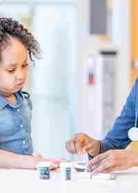 Child At Hospital With Doctor